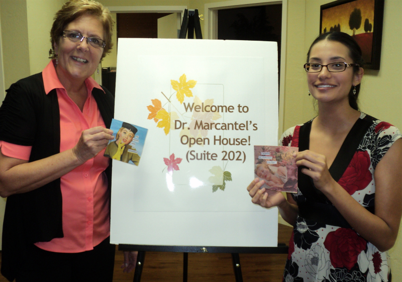 Dr. M and Brianna show off some fun napkins contributed by one of our wonderful patients.